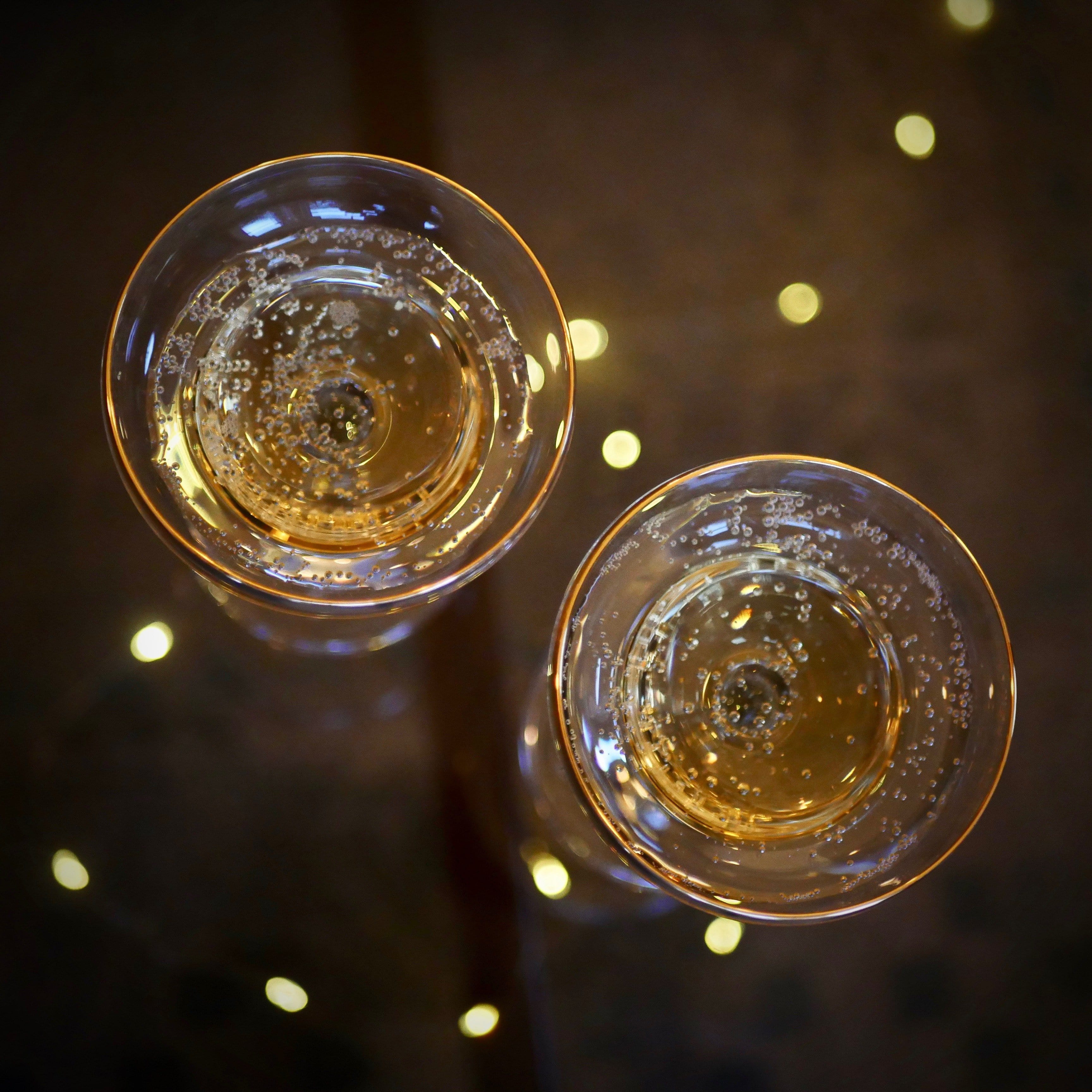 Gold rimmed champagne glasses