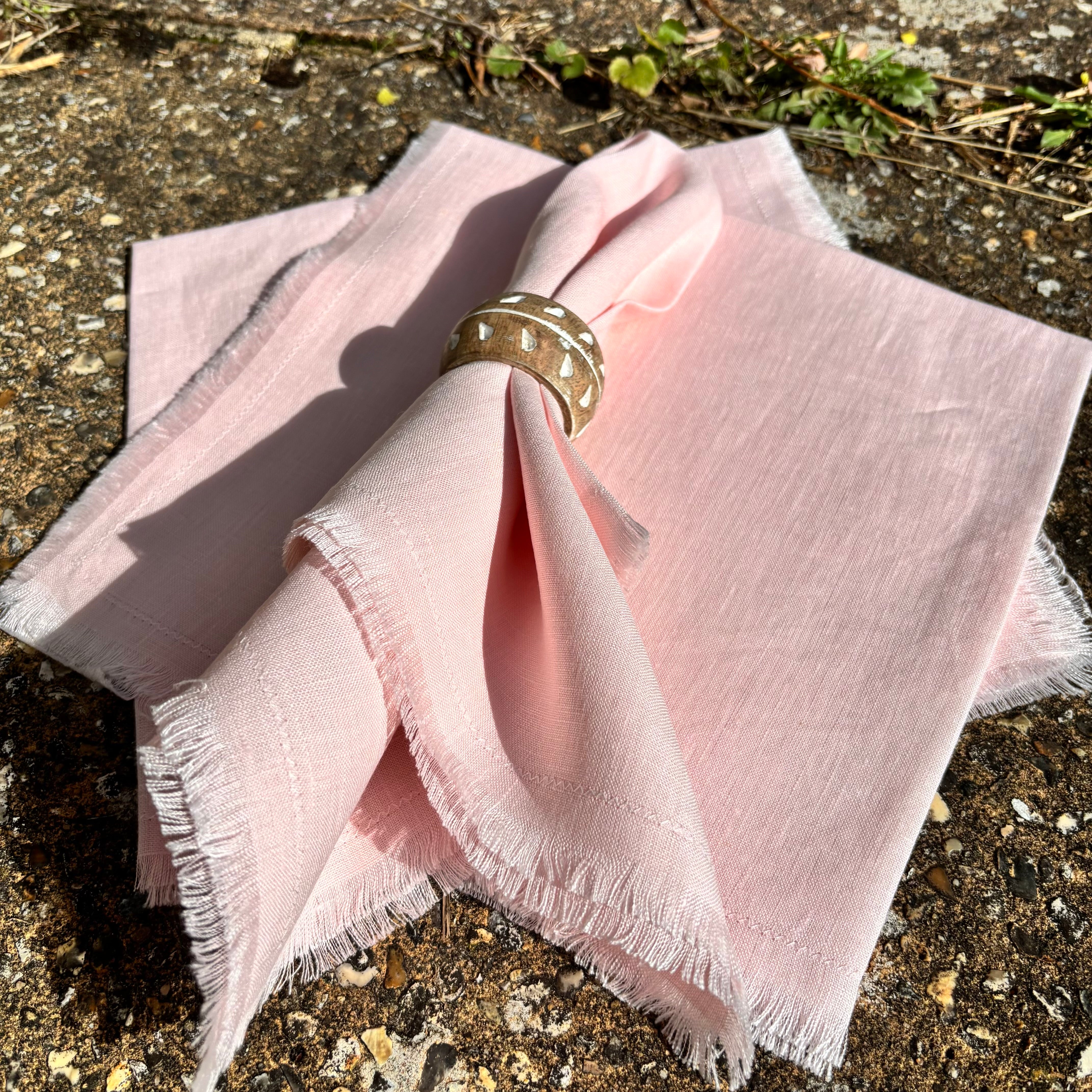 blush pink fringed napkins for wedding tableware hire