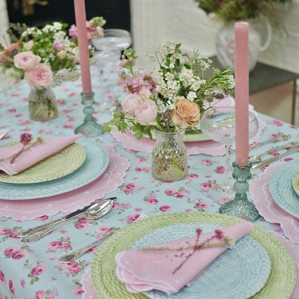 Summer Tablescape wicker plates, cut glass candlesticks, rosebud tablecloth