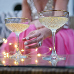 Load image into Gallery viewer, Vintage-style gold rimmed champagne saucers
