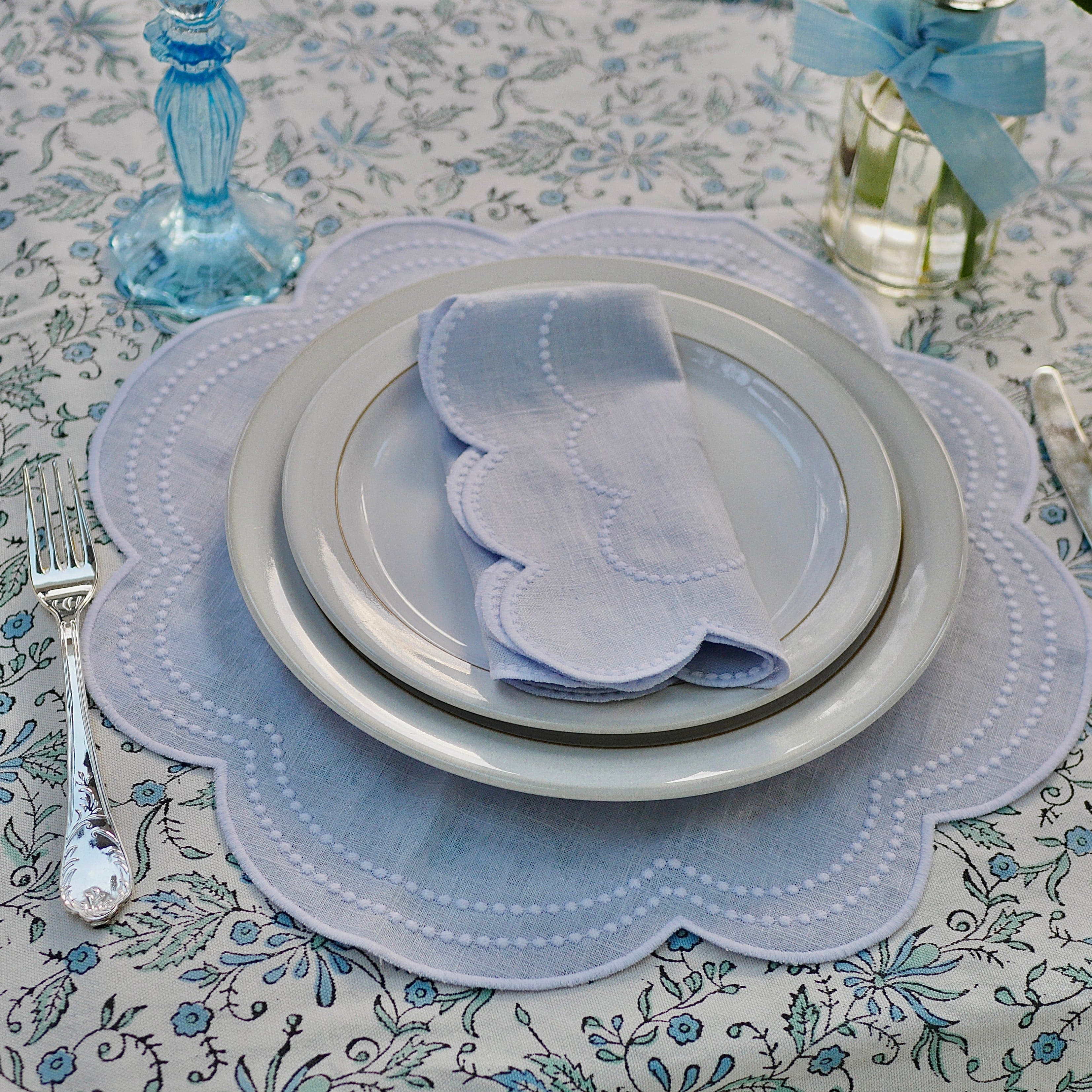 blue scalloped placemat and napkin